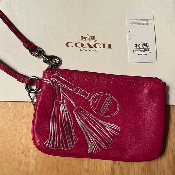 Coach wristlet wallet Fuchsia Leather Wristlet w/silver embossedTassel Design
